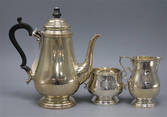 A Queen Anne style silver coffee pot with matching sugar bowl and cream jug, Sheffield 1967, maker: Cooper Brothers & Sons,